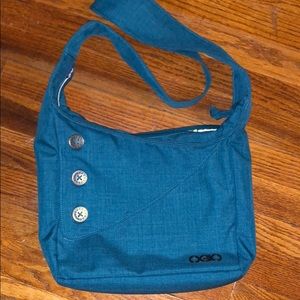 Blue OGIO Crossbody bag with padded tablet pocket